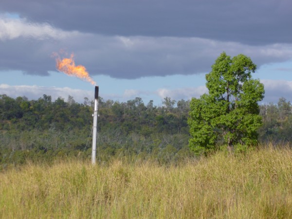 Coal seam gas being flared from a production site in rural Queensland